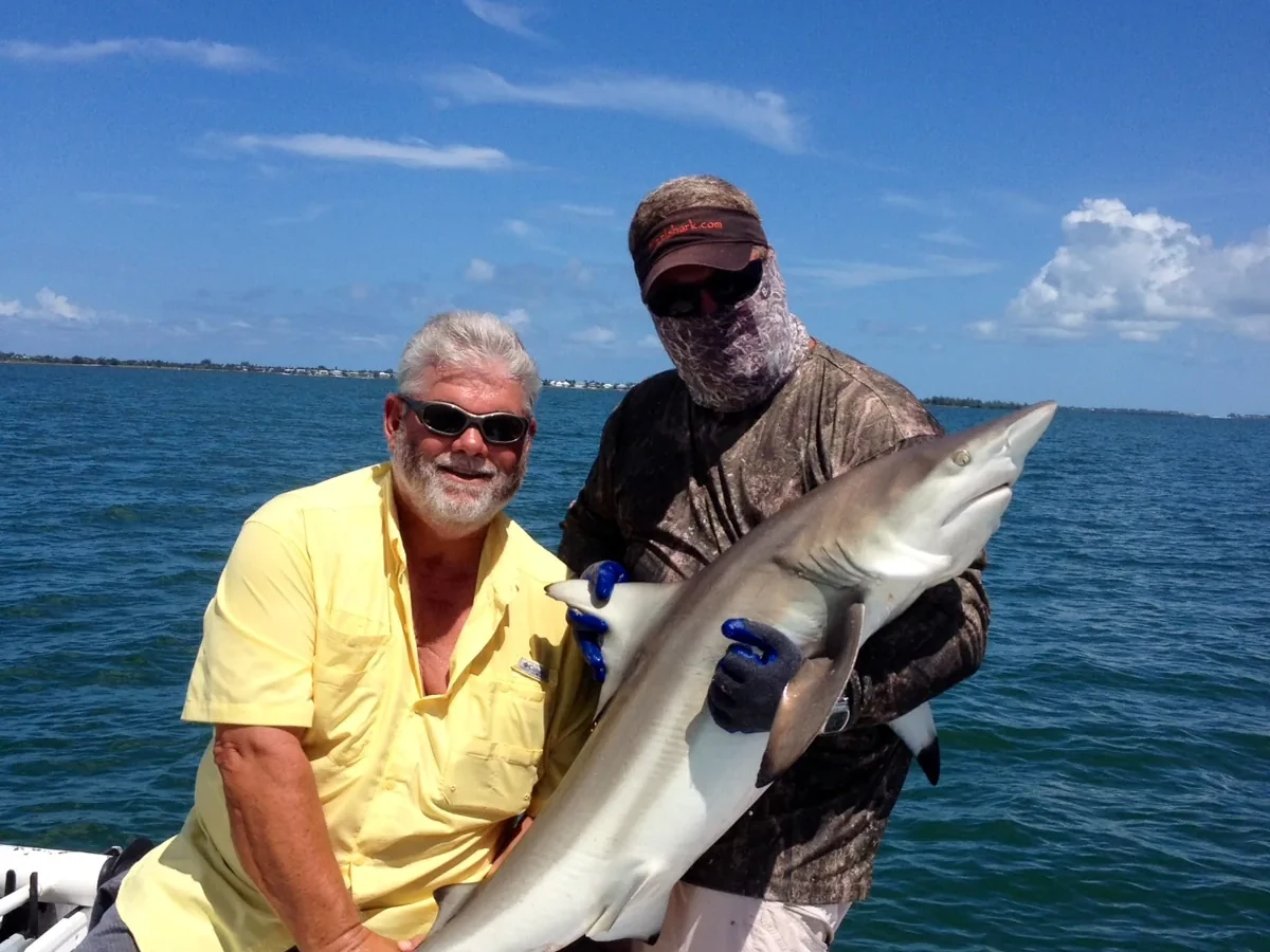 Captain Mike holding a shark catch